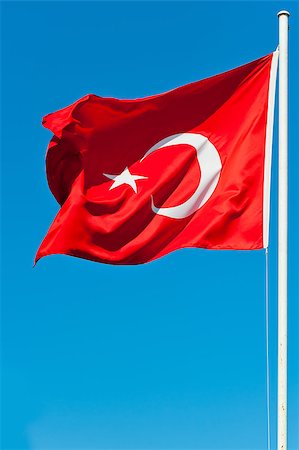 people waving at sky city - developing in the wind flag of Turkey Stock Photo - Budget Royalty-Free & Subscription, Code: 400-07416767