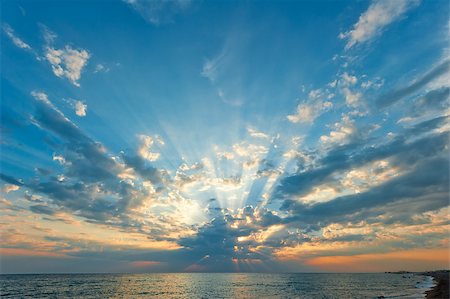 beautiful clouds with the setting sun over the sea Stock Photo - Budget Royalty-Free & Subscription, Code: 400-07416782
