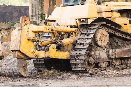 Bulldozer machine doing earth moving work in construction site Stock Photo - Budget Royalty-Free & Subscription, Code: 400-07417167