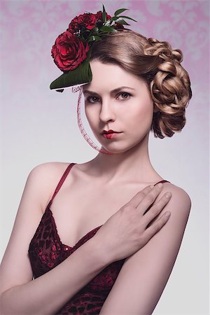 sexy blonde girl with romantic floral hair-style, sexy red dress and heart shaped lipstick. Red roses in the hair Stock Photo - Budget Royalty-Free & Subscription, Code: 400-07418084