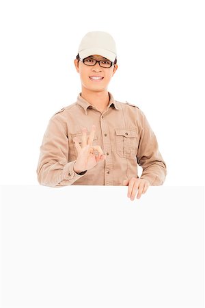 delivery man make  ok gesture with white board Stock Photo - Budget Royalty-Free & Subscription, Code: 400-07418322