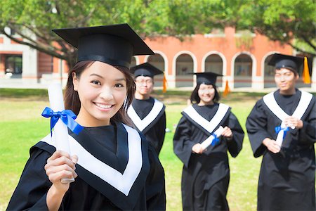 smiling college graduate show a diploma Stock Photo - Budget Royalty-Free & Subscription, Code: 400-07418354