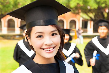 beautiful female college graduate with classmates at ceremony Stock Photo - Budget Royalty-Free & Subscription, Code: 400-07418353