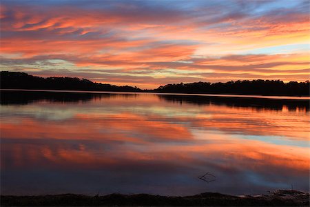 simsearch:400-07514503,k - Sunrise and the sky became on fire and mirror reflections in the beautiful Narrabeen Lakes.  Sydney, Australia Stock Photo - Budget Royalty-Free & Subscription, Code: 400-07418593