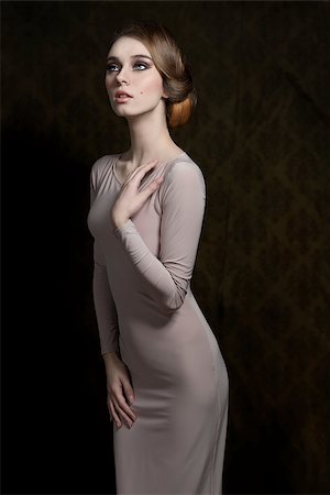 simsearch:400-07680948,k - cool fashion portrait of slim woman with elegant style, gray dress and classic hair-style. Stock Photo - Budget Royalty-Free & Subscription, Code: 400-07419369