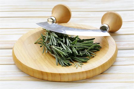 simsearch:400-05381074,k - Fresh fragrant green rosemary on a cutting board Stock Photo - Budget Royalty-Free & Subscription, Code: 400-07419789