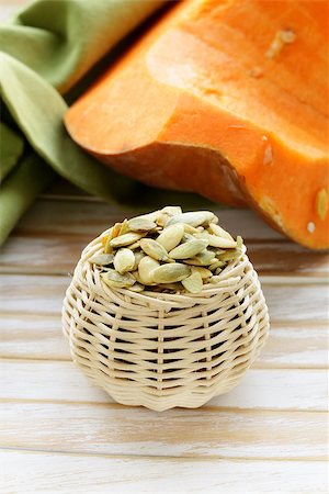 simsearch:400-06954534,k - peeled pumpkin seeds and fresh pumpkin on a wooden table Stock Photo - Budget Royalty-Free & Subscription, Code: 400-07419791