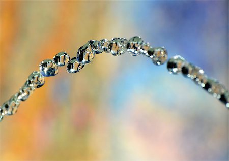 Closeup of water drops on colorful background. Foto de stock - Royalty-Free Super Valor e Assinatura, Número: 400-07410078