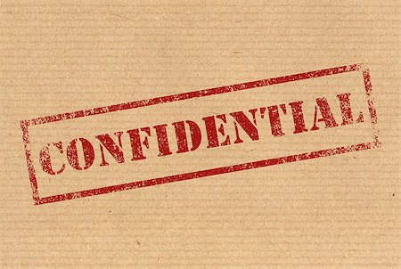 Confidential red rubber ink stamp on karft paper texture Stock Photo - Budget Royalty-Free & Subscription, Code: 400-07410219