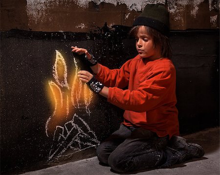 Homeless boy warming at virtual drawn fire kneeling near a wall - social issues concept Foto de stock - Super Valor sin royalties y Suscripción, Código: 400-07410574