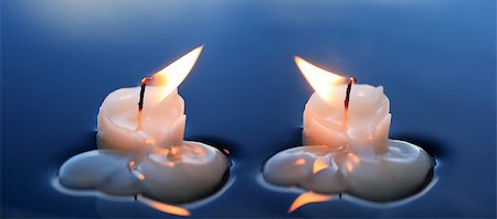 simsearch:400-04210315,k - Two lighting candles on calm blue water Stock Photo - Budget Royalty-Free & Subscription, Code: 400-07410617