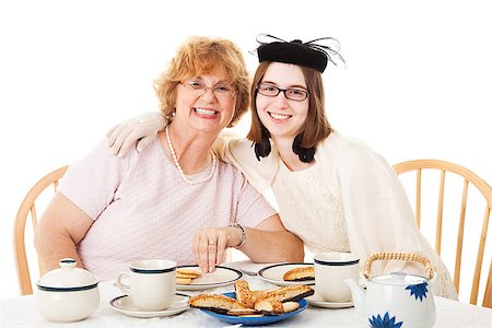 Mother and teenage daughter having a formal tea party.  White background. Stock Photo - Budget Royalty-Free & Subscription, Code: 400-07411047