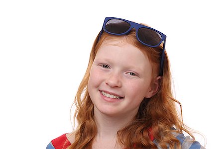 simsearch:400-08336541,k - Portrait of a red-haired young girl wearing sunglasses on white background Photographie de stock - Aubaine LD & Abonnement, Code: 400-07411166