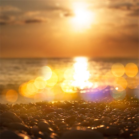 Close Up of Sea Pebble at Sunset. Shallow Depth of Field and Beautiful Bokeh. Toned Photo. Foto de stock - Super Valor sin royalties y Suscripción, Código: 400-07411390