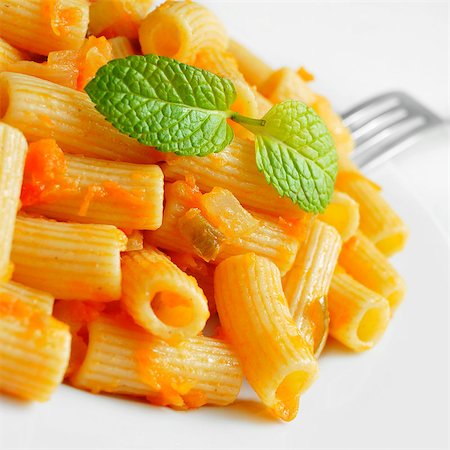 rigate - closeup of a penne rigate with tomato sauce Stock Photo - Budget Royalty-Free & Subscription, Code: 400-07411607