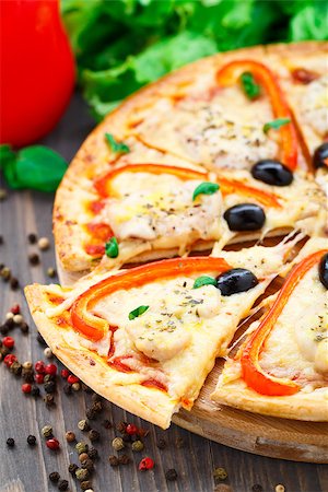 Delicious pizza with chicken, pepper and olives Stock Photo - Budget Royalty-Free & Subscription, Code: 400-07412165