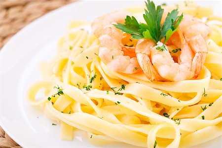 Delicious pasta with shrimps on a plate Stock Photo - Budget Royalty-Free & Subscription, Code: 400-07412181