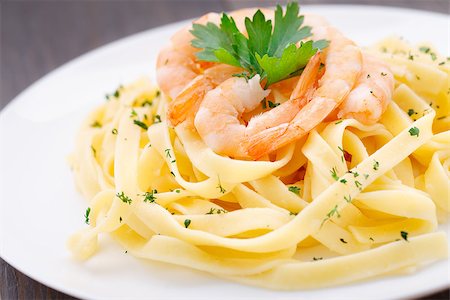 Delicious pasta with shrimps on a plate Stock Photo - Budget Royalty-Free & Subscription, Code: 400-07412182