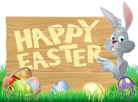 simsearch:400-07307426,k - Easter bunny peeking round a sign and pointing, chocolate Easter eggs in the foreground Stock Photo - Budget Royalty-Free & Subscription, Code: 400-07412417