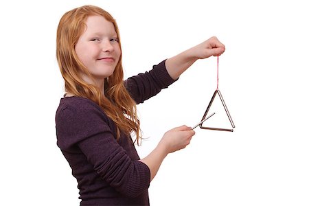 play a triangle - Happy girl playing a triangle instrument on white background Stock Photo - Budget Royalty-Free & Subscription, Code: 400-07412641