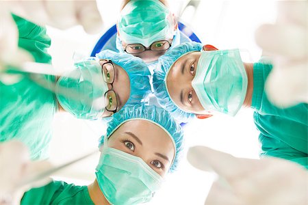 female paramedics in gloves - Team surgeon at work in operating room. Stock Photo - Budget Royalty-Free & Subscription, Code: 400-07412766