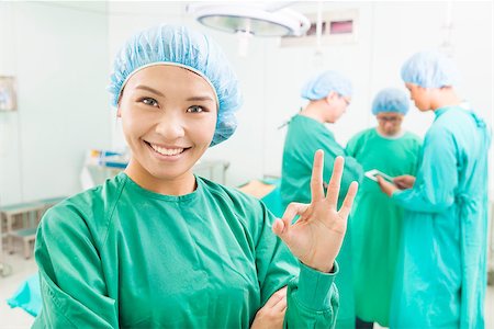 surgeons finish the operation and thumb up Stock Photo - Budget Royalty-Free & Subscription, Code: 400-07412776