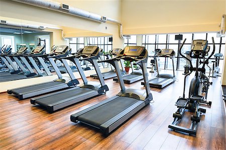 starush (artist) - Set of treadmills staying in line in the gym Stockbilder - Microstock & Abonnement, Bildnummer: 400-07424144