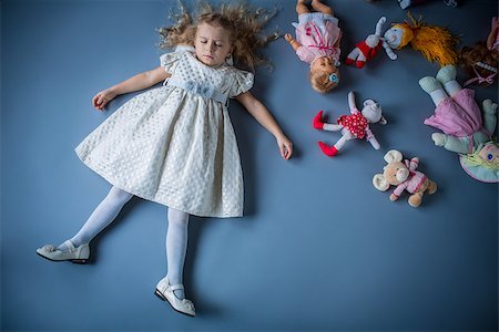 Little girl with toys in studio Stock Photo - Budget Royalty-Free & Subscription, Code: 400-07424215