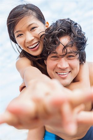 simsearch:400-08291180,k - Man & woman Asian couple, boyfriend girlfriend in bikini, taking vacation selfie photograph at the beach Foto de stock - Royalty-Free Super Valor e Assinatura, Número: 400-07424598