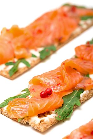 simsearch:400-07572419,k - Salted salmon on crispy bread with cheese and arugula, closeup Stock Photo - Budget Royalty-Free & Subscription, Code: 400-07424623