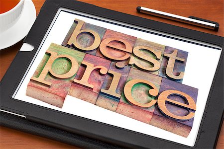 best price advertising - text in vintage letterpress wood type on a digital tablet with a cup of tea Stock Photo - Budget Royalty-Free & Subscription, Code: 400-07424632