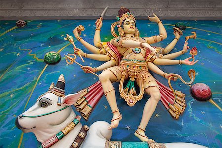 simsearch:851-02960478,k - Nataraj Dancing Form of Lord Shiva Hindu God Standing on Sacred Cow on Temple Exterior Wall Photographie de stock - Aubaine LD & Abonnement, Code: 400-07424732