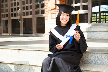 Asian college student holding a diploma at campus Stock Photo - Budget Royalty-Free & Subscription, Code: 400-07425871