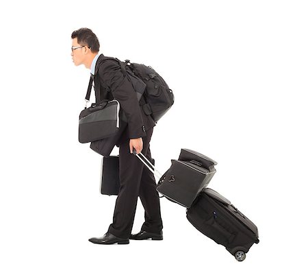 tired young businessman pulling and taking all belongings Stock Photo - Budget Royalty-Free & Subscription, Code: 400-07425922