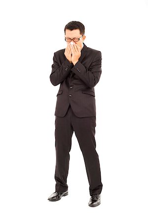 sick young businessman is sneezing with toilet paper Stock Photo - Budget Royalty-Free & Subscription, Code: 400-07425946