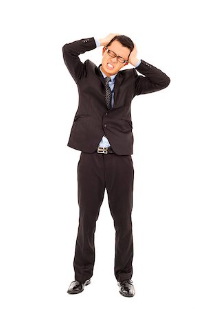 businessman have a headache with painful expression Stock Photo - Budget Royalty-Free & Subscription, Code: 400-07425941