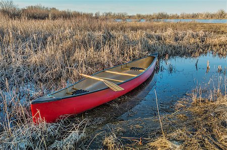 red canoe on lake - red canoe with a wooden paddle in a wetland, early spring Stock Photo - Budget Royalty-Free & Subscription, Code: 400-07425961