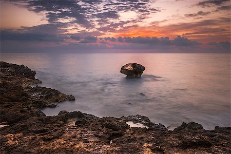 Rocky Beach and Colourful Sky on Cloudy Morning Stock Photo - Budget Royalty-Free & Subscription, Code: 400-07426147