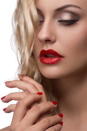 sexy young girl with red lips and nail polish, shiny wavy blonde hair Photographie de stock - Aubaine LD & Abonnement, Code: 400-07426362