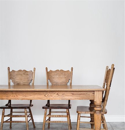 Wooden Dining room table and chair details and blank wall for your text, image or logo. Photographie de stock - Aubaine LD & Abonnement, Code: 400-07426733