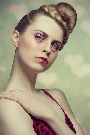 sexy woman with romantic valentines style, heart shaped make-up and creative hair-style. Wearing sexy red dress Photographie de stock - Aubaine LD & Abonnement, Code: 400-07427699