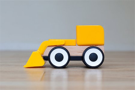 Simple wheel dozer toy, plastic and wood Stock Photo - Budget Royalty-Free & Subscription, Code: 400-07428011