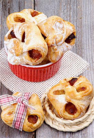 rolled biscuit - Arrangement of Homemade Pastry Baskets Jam Wrapped with Sugar Powder in Various Bowls closeup on Rustic Wooden background Stock Photo - Budget Royalty-Free & Subscription, Code: 400-07428259