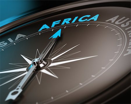 simsearch:400-08184863,k - Abstract compass needle pointing the destination africa, blue and brown tones with focus on the main word. Concept image suitable for illustration of trip counseling. Photographie de stock - Aubaine LD & Abonnement, Code: 400-07428266