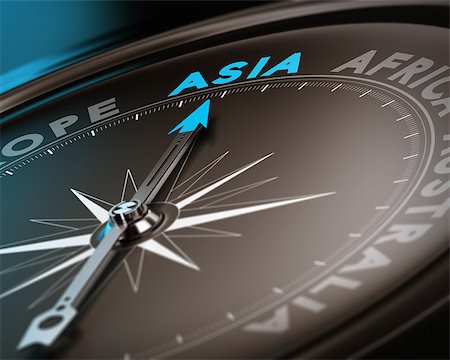 simsearch:400-08184863,k - Abstract compass needle pointing the destination asia, blue and brown tones with focus on the main word. Concept image suitable for illustration of trip counseling. Photographie de stock - Aubaine LD & Abonnement, Code: 400-07428267