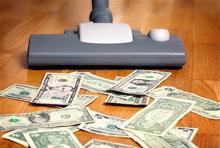 Vacuum cleaner sucks on U.S. dollars Stock Photo - Budget Royalty-Free & Subscription, Code: 400-07428457