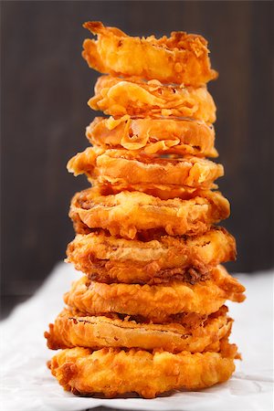 simsearch:400-08428899,k - Homemade crunchy fried onion rings on a parchment Foto de stock - Super Valor sin royalties y Suscripción, Código: 400-07428485