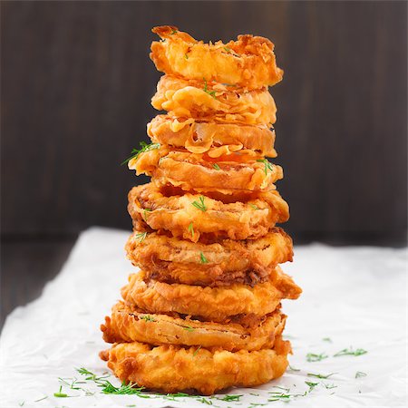 simsearch:400-08428899,k - Homemade crunchy fried onion rings on a parchment Foto de stock - Super Valor sin royalties y Suscripción, Código: 400-07428486