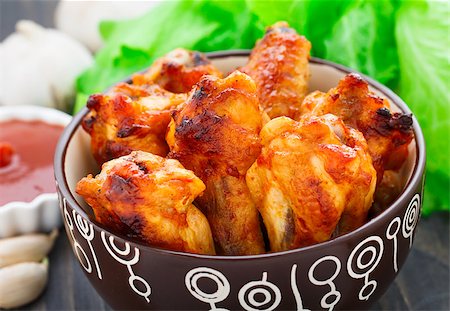 simsearch:400-05708291,k - Delicious baked chicken wings in a bowl Stock Photo - Budget Royalty-Free & Subscription, Code: 400-07428482