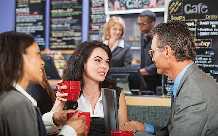 simsearch:400-07553657,k - Mixed group of coworkers talking in a cafe Stockbilder - Microstock & Abonnement, Bildnummer: 400-07428566